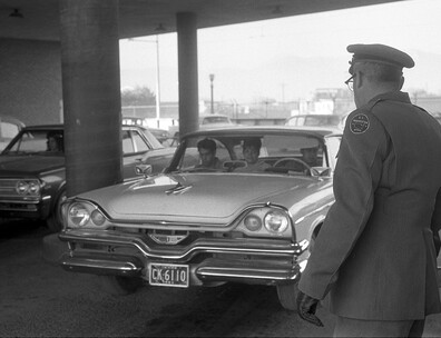 U.S. immigration officer watches as car enters El Paso, Texas, from Ciudad Juárez